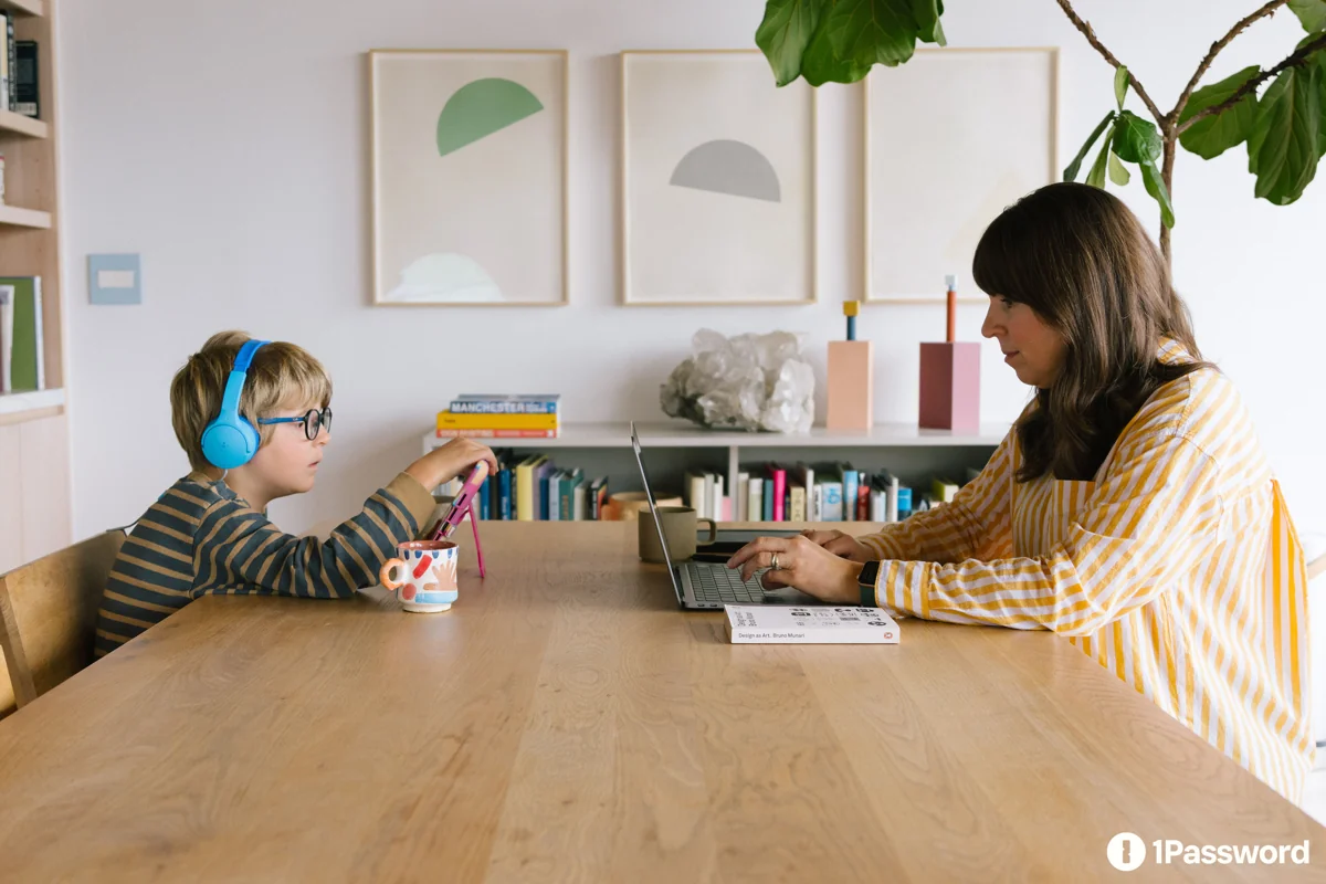 A family using devices at home in an official 1Password editorial photograph